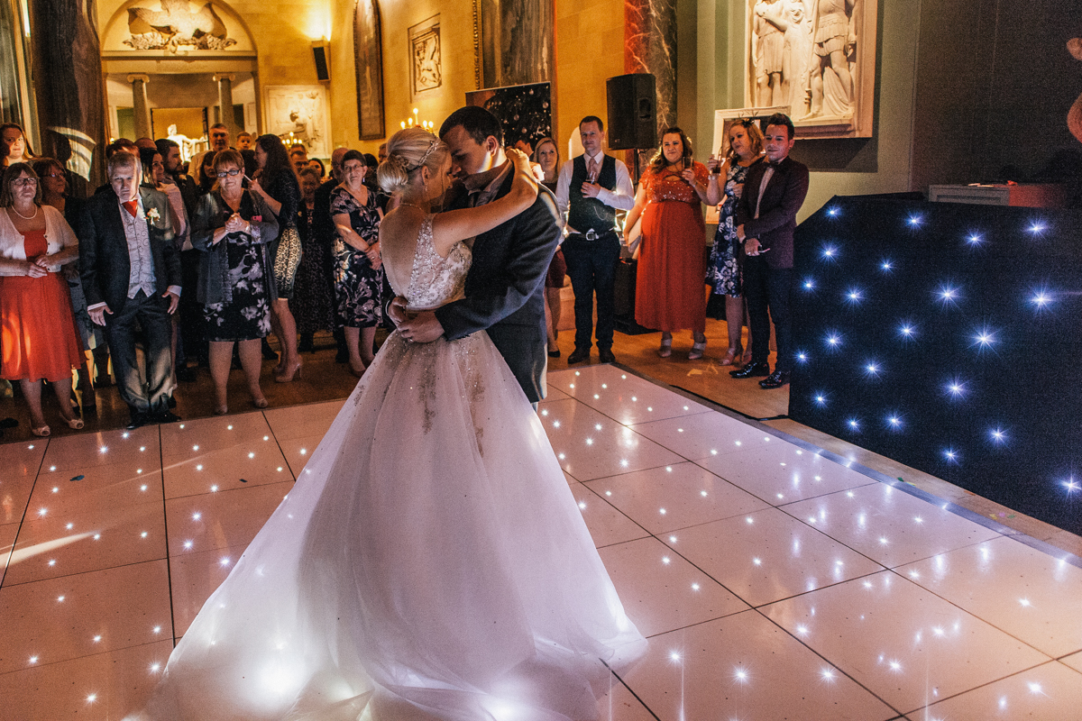 winter wedding photography bride and groom with fairy lights dance floor venue woburn abbey 