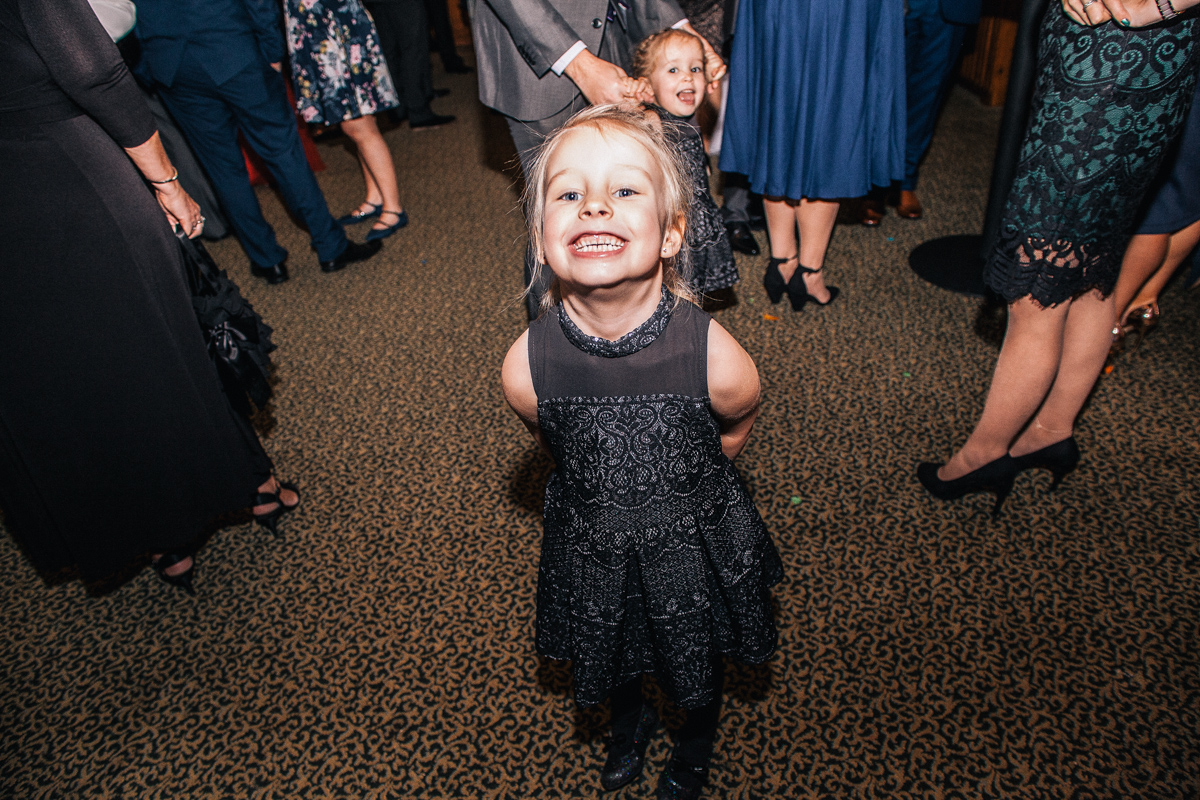 child smiling wedding guest