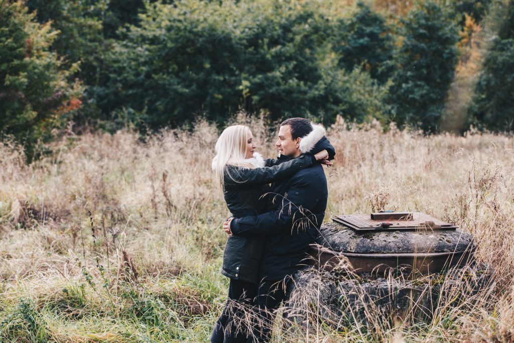 Engaged couple standing close in chorlton park manchester during a relaxed engagement shoot 