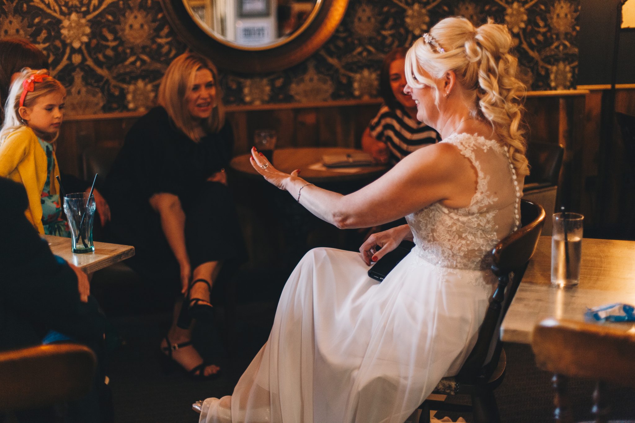 bride showing her ring to guests