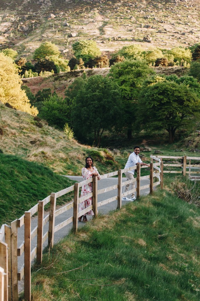 Engaged couple standing close in peak district during a relaxed engagement shoot twilight