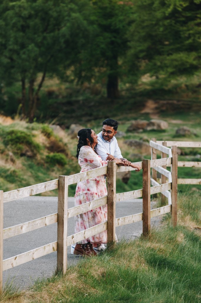 Engaged couple standing close in peak district during a relaxed engagement shoot twilight
