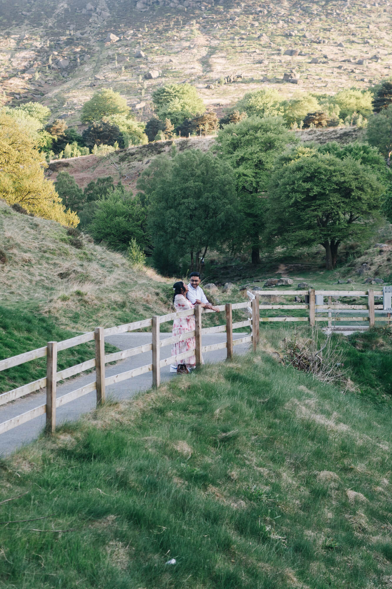 Barati and Kartik walking together during their Peak District engagement photography session