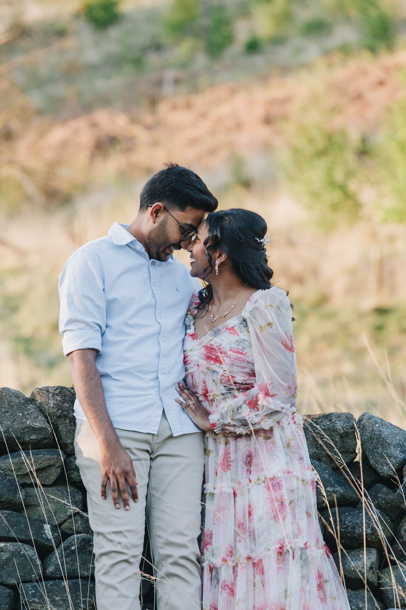 Candid moment of Barati and Kartik laughing during their engagement photography