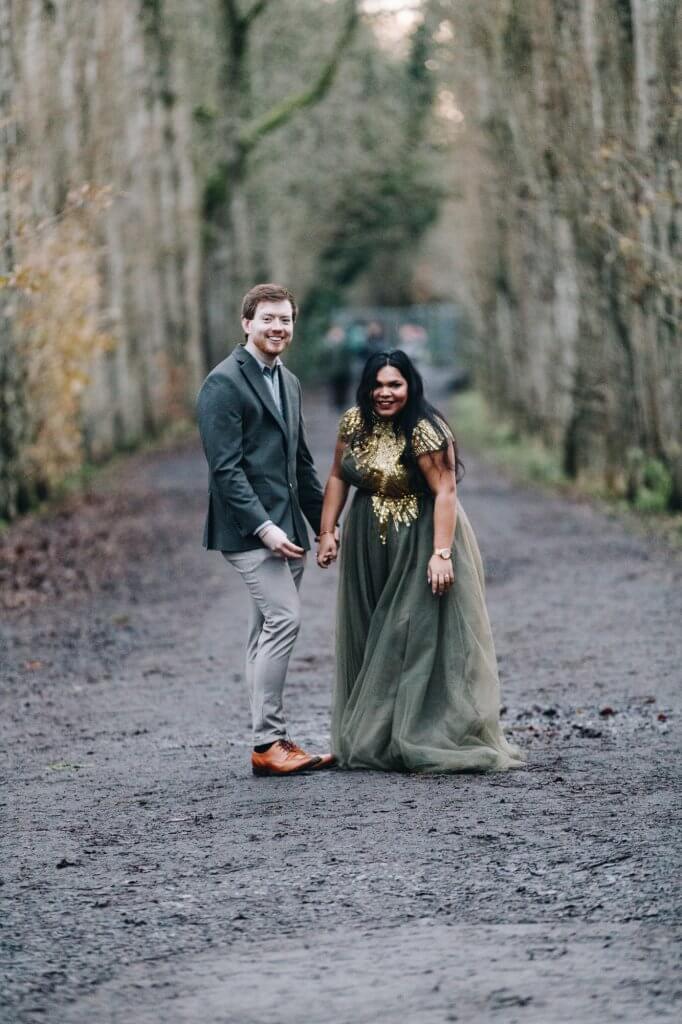 Couple walking through Fletcher Moss Botanical Gardens Manchester