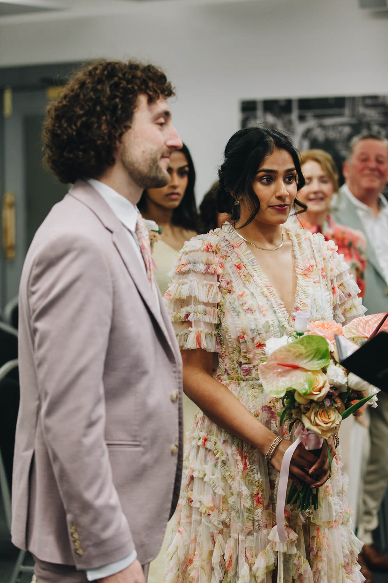 Couple smiling during civil wedding at Albert Rooms Bolton Bolton wedding photographer