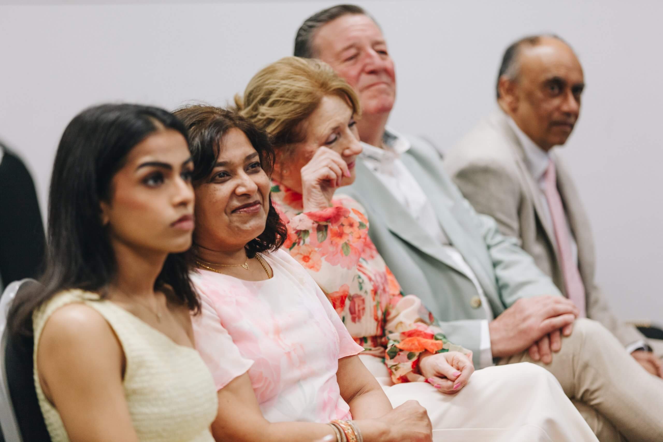 Candid wedding moment laughter during intimate Bolton wedding ceremony