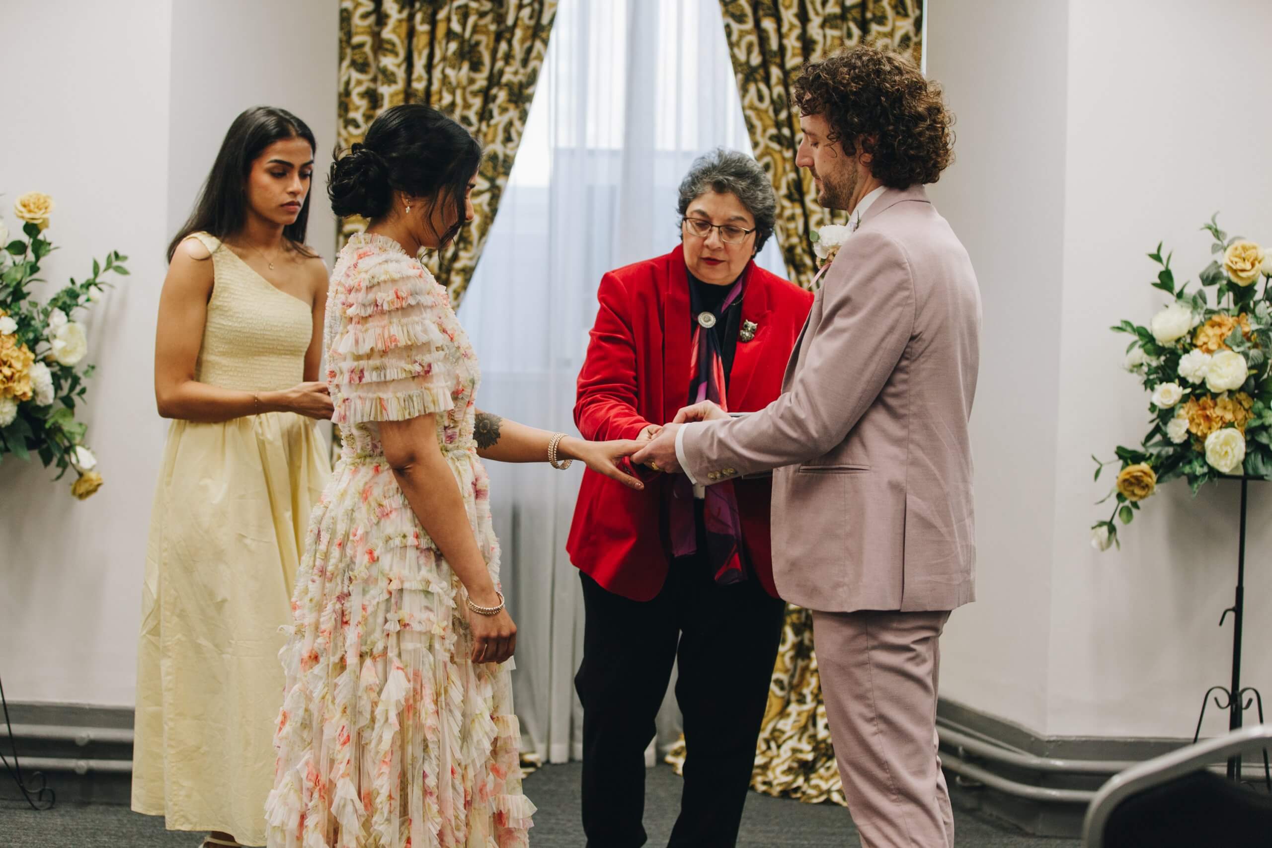 Bride and groom exchanging vows at Albert Rooms Bolton Greater Manchester wedding photographer