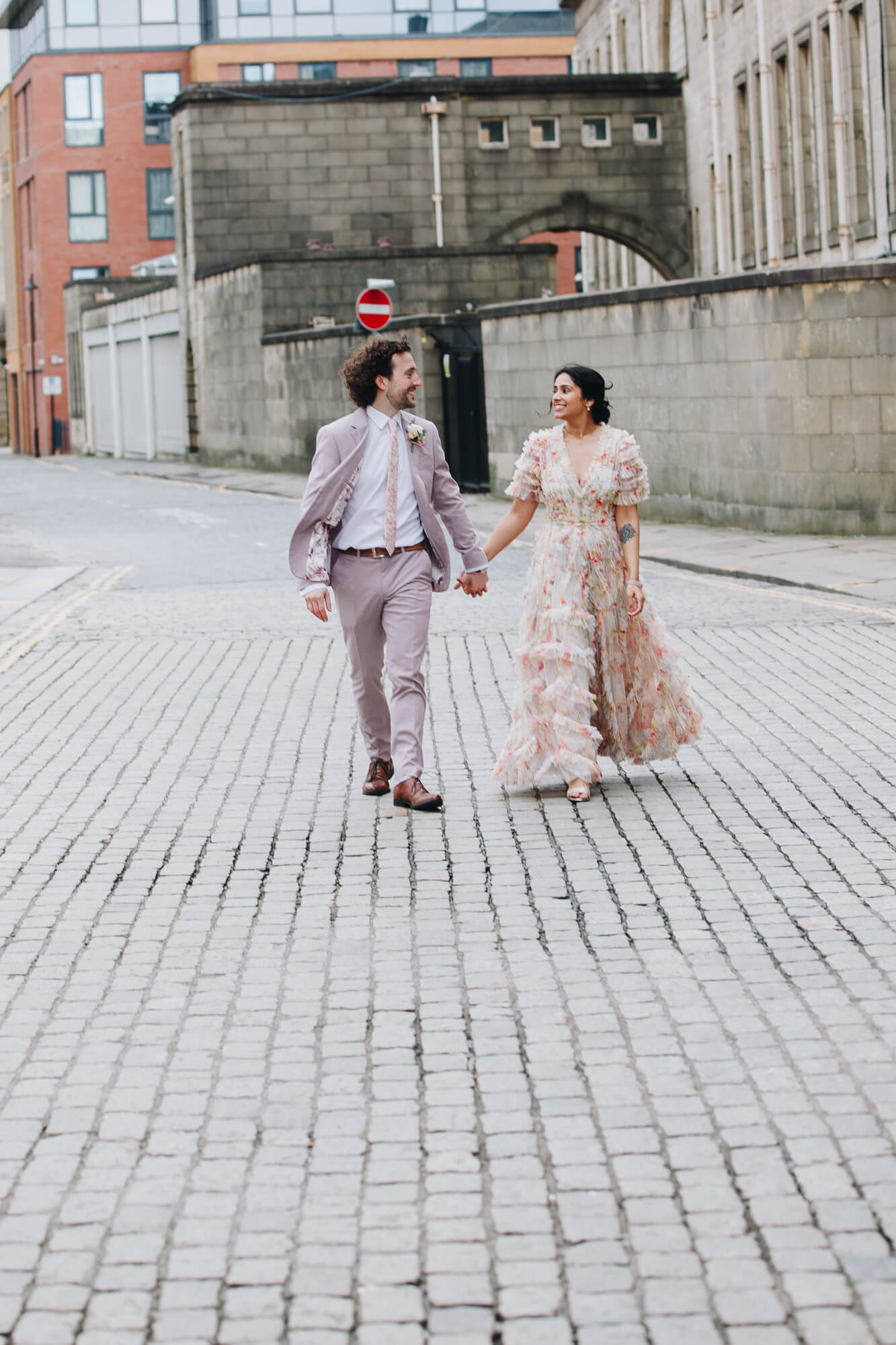 Relaxed newlywed portraits in Bolton town centre