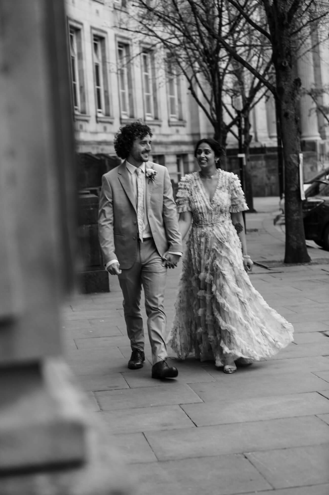 Newlyweds exploring Bolton streets after civil ceremony