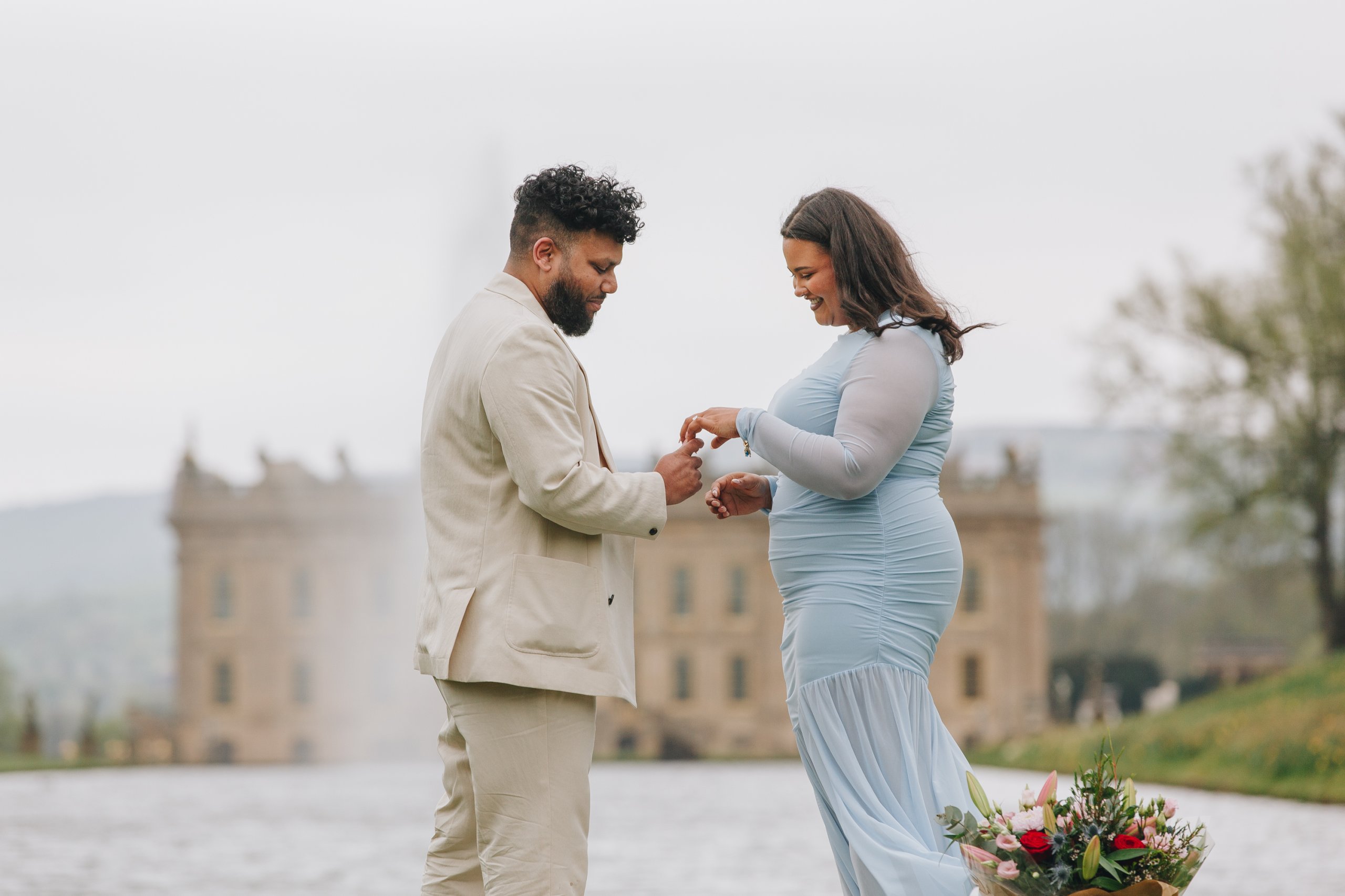 Candid engagement moment in English countryside garden setting