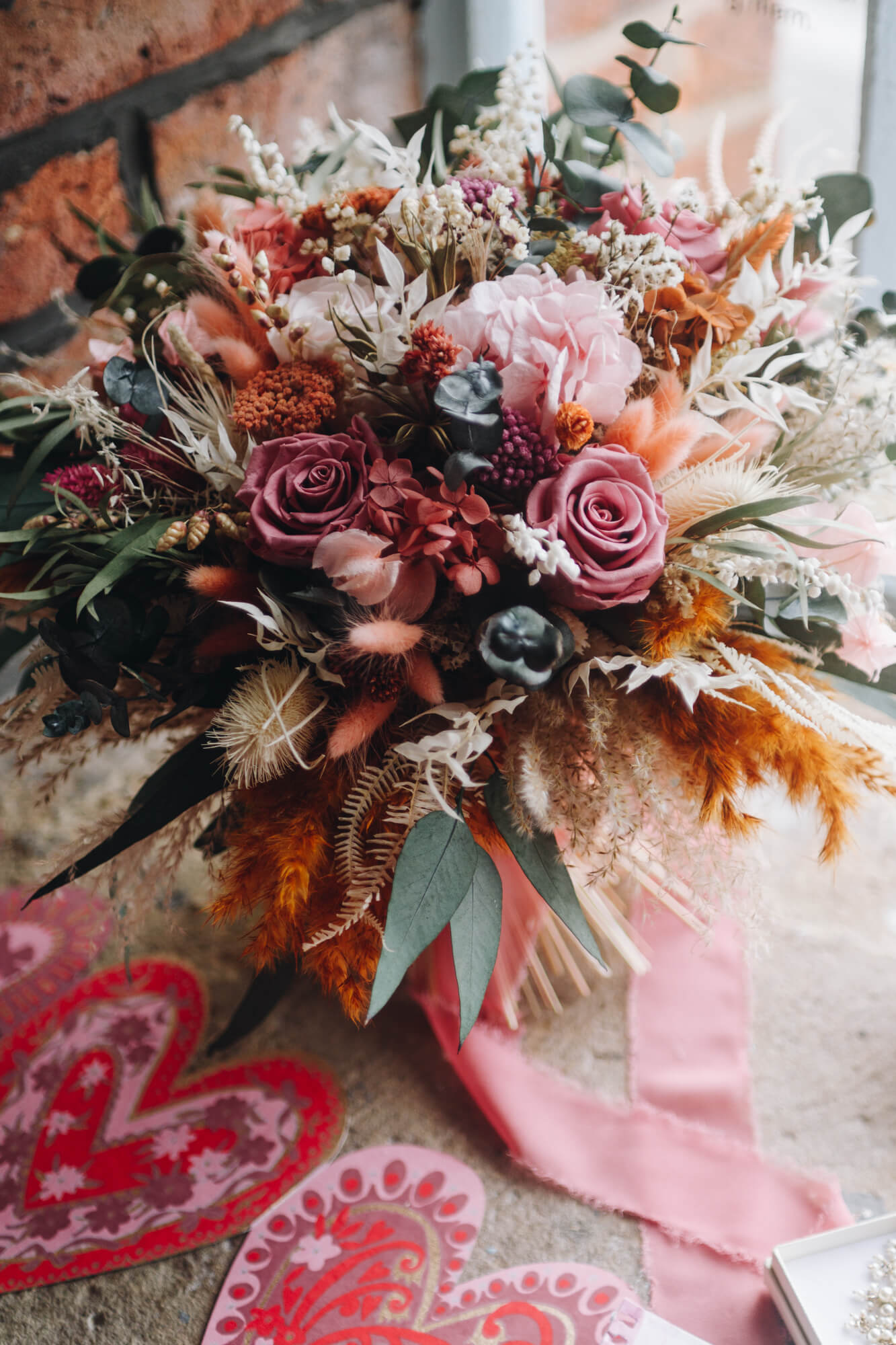 Bridal bouquet and wedding accessories photographed before ceremony