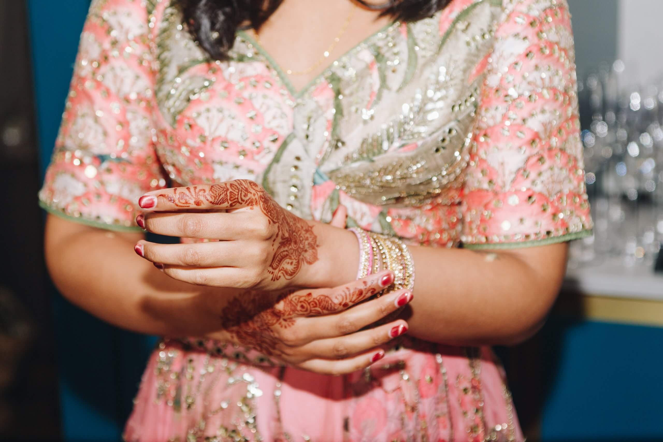 Bride putting on bangles Native Manchester apartment