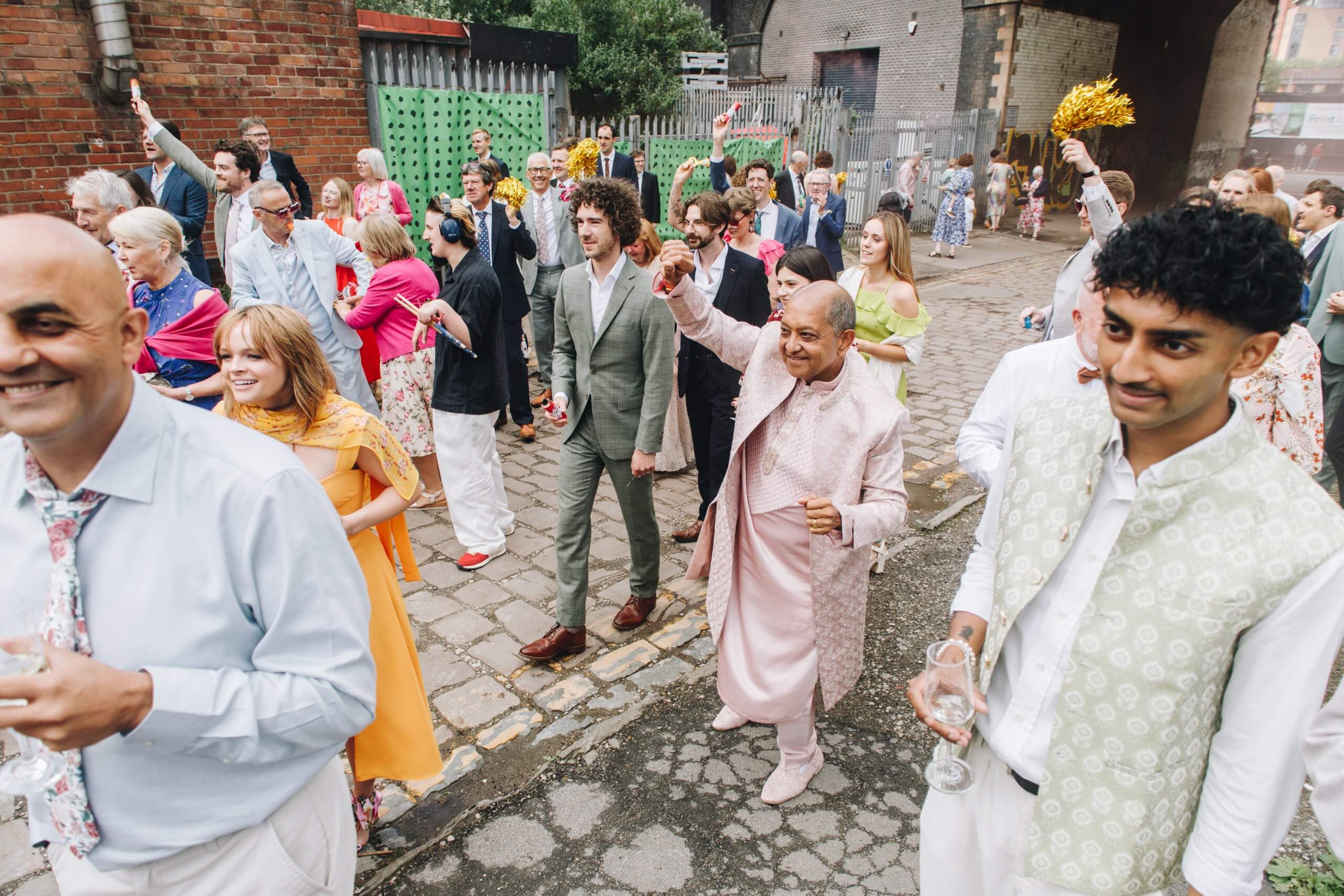Family and friends celebrating multicultural wedding in Manchester
