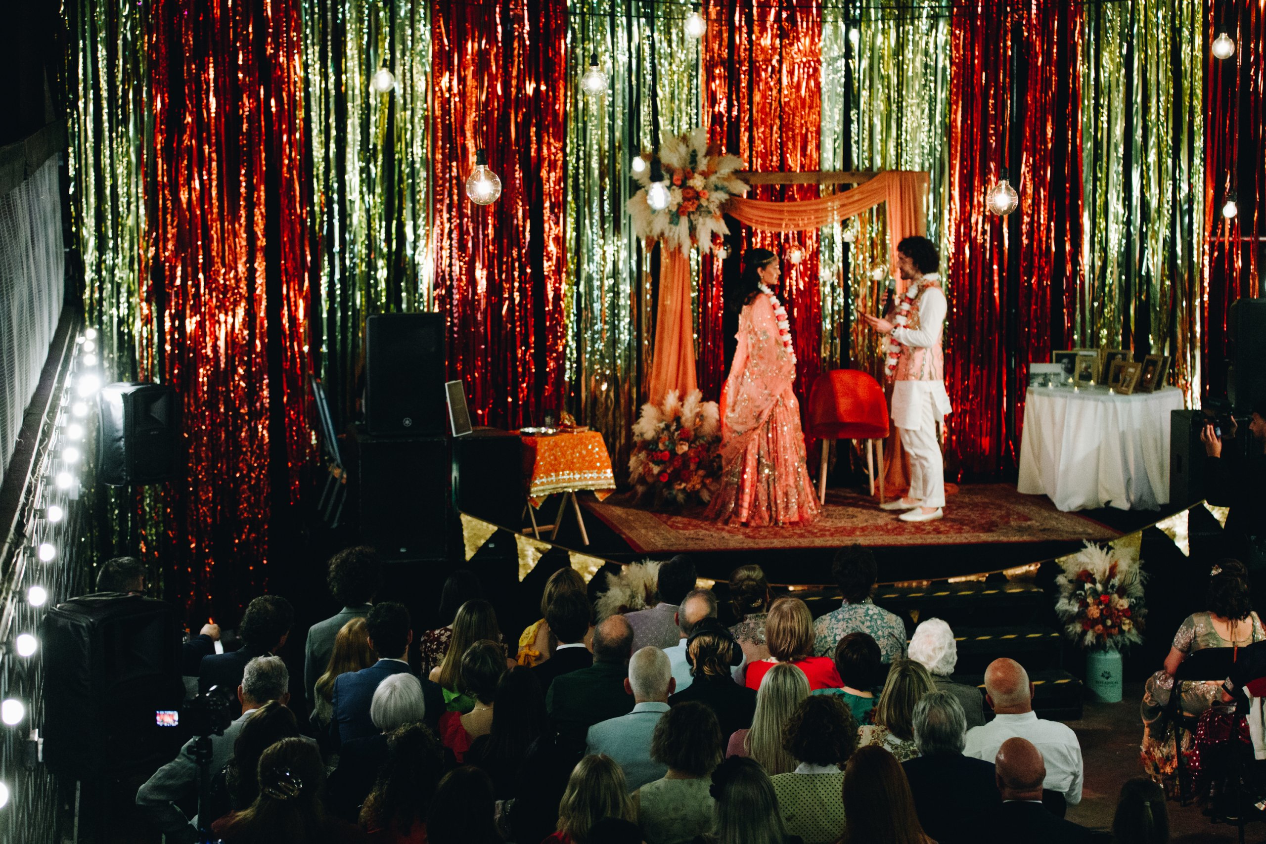 Couple exchanging vows during Manchester fusion wedding