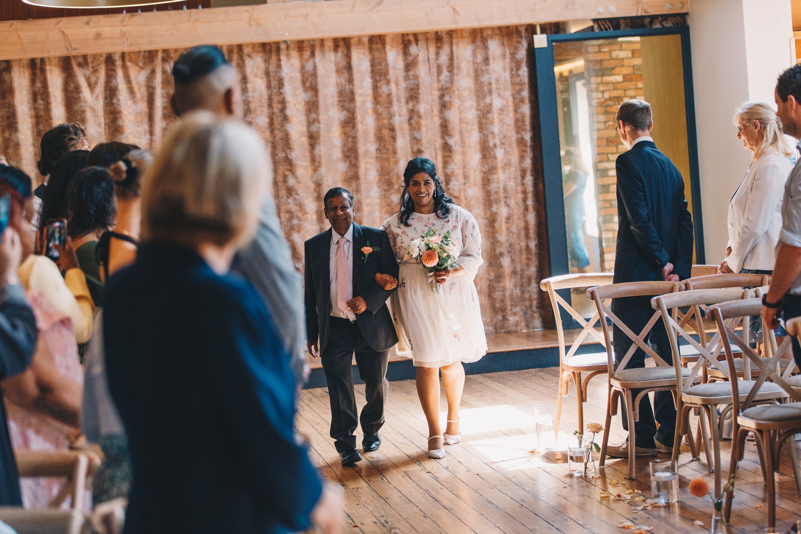 Bride walking down the aisle at The Castlefield Rooms Manchester