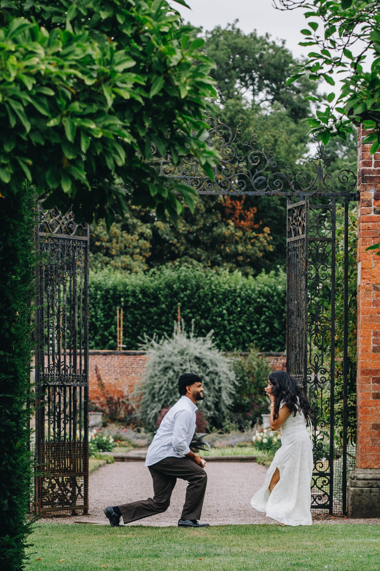 couple celebrating their engagement at Arley Hall Gardens