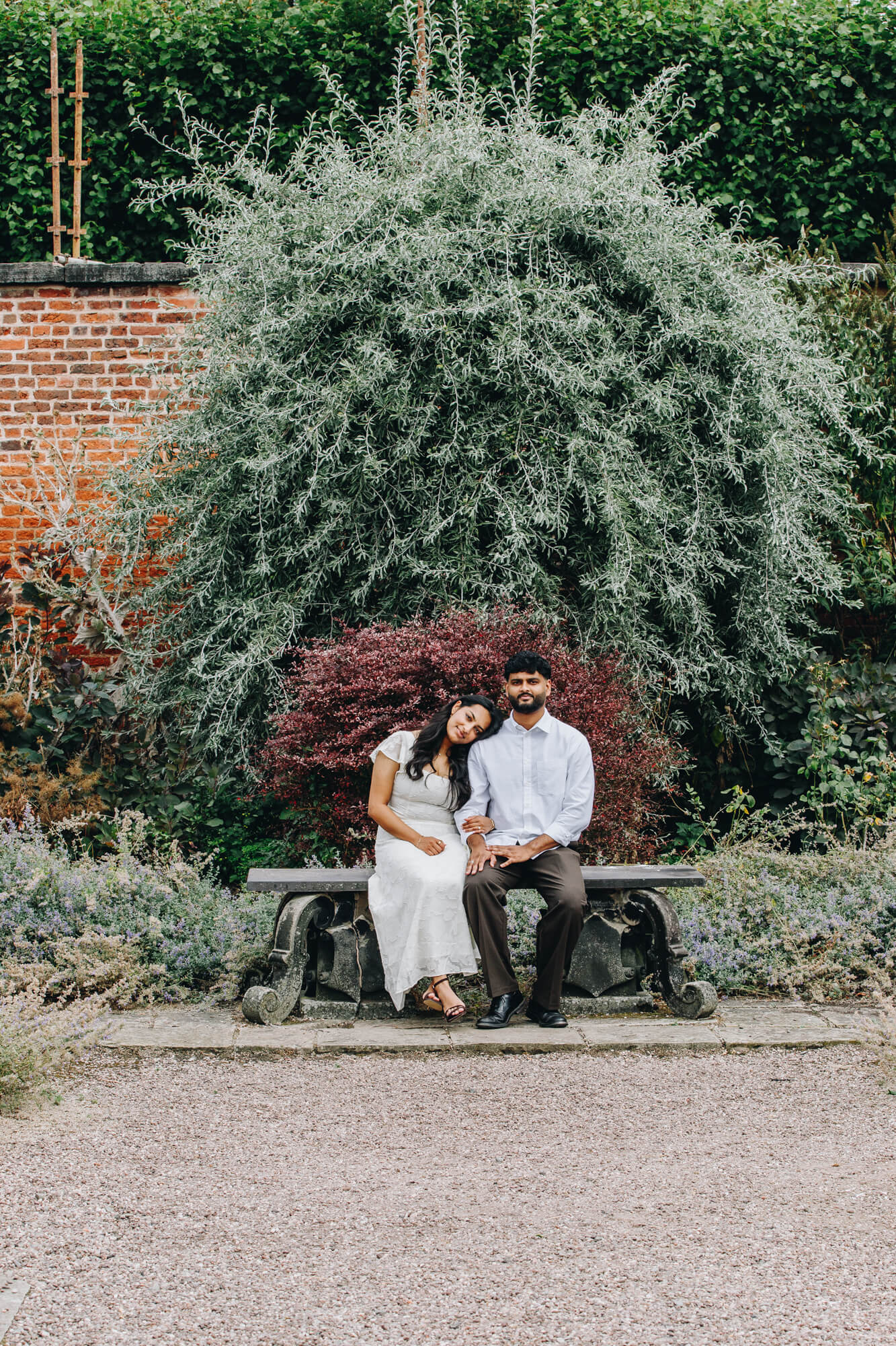 engaged couple sharing a moment in the gardens